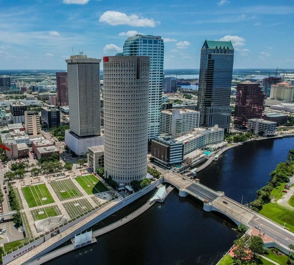Downtown Tampa Skyline next to Hillsborough River. Rivergate building in front next to Riverwalk.