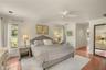 Large primary bedroom featuring tile flooring and ample space for a private retreat