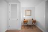 Home office with wood finished floors and baseboards