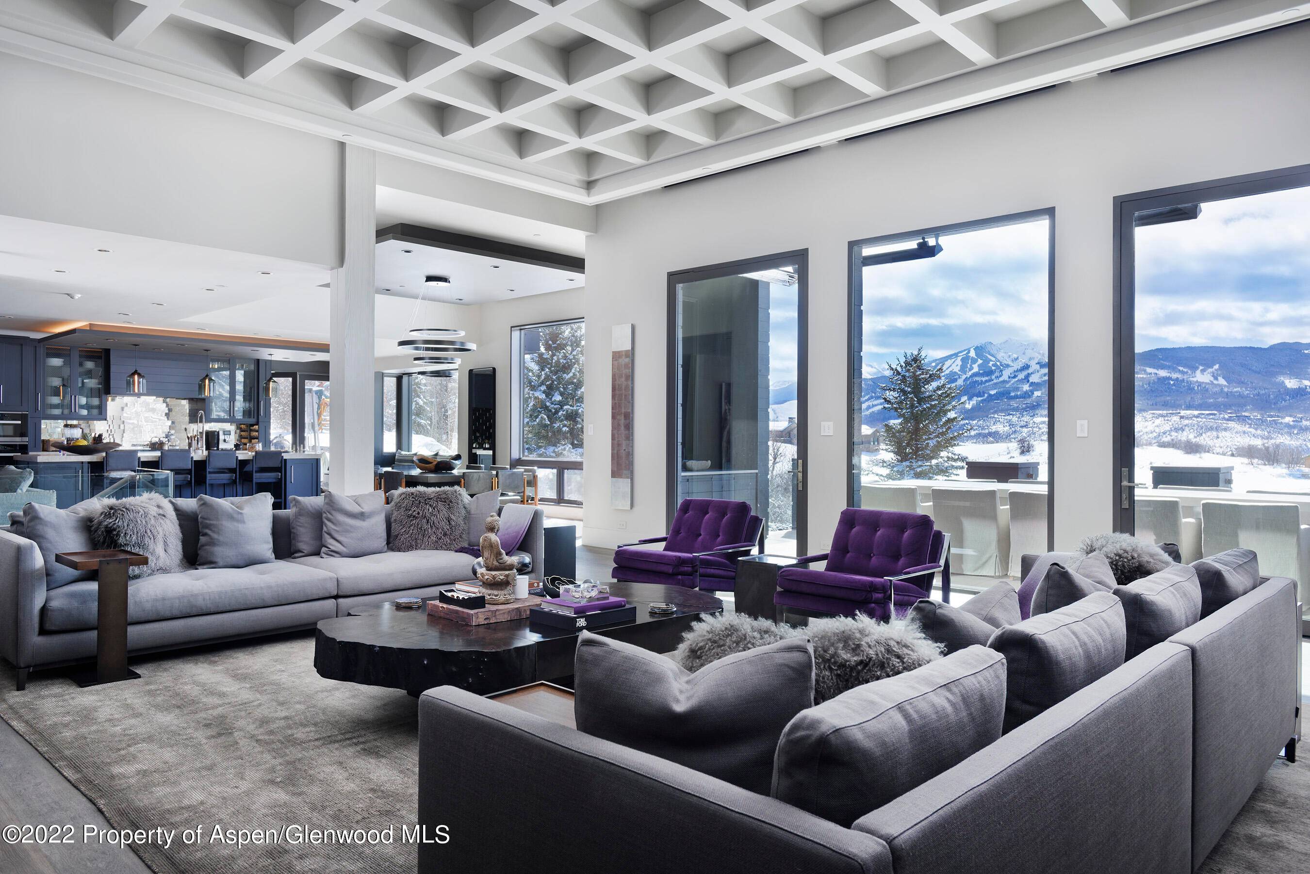Take in panoramic mountain views from the floor to ceiling windows in this two story home that seamlessly incorporates natural light and a sense of place here in the mountains.