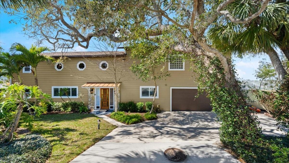 Exterior front photo of 2306 John Anderson Dr., Ormond Beach, Intracoastal Waterway views, Charming two story home with tropical landscaping, Boat lif