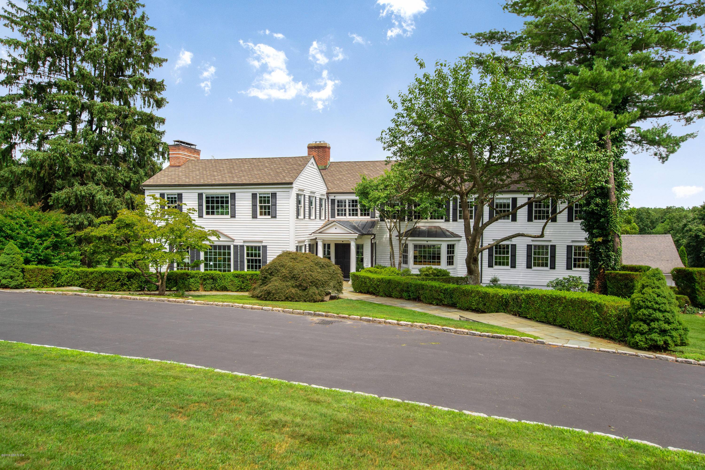 CONNECTICUT CLASSIC. CENTER HALL COLONIAL, GRACIOUS FOYER WITH COFFERED CEILING LEADS TO FORMAL L R.