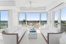 Living area with ceiling fan, french doors, plenty of natural light, and recessed lighting