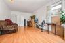 Workout room with light wood-style floors and baseboards