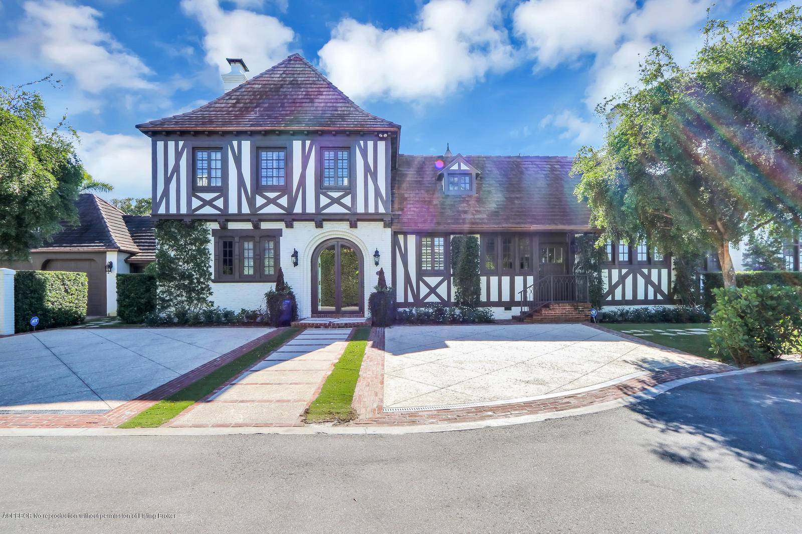 A stunning Maurice Fatio landmark mansion with several bedrooms and gracious spaces on each level.