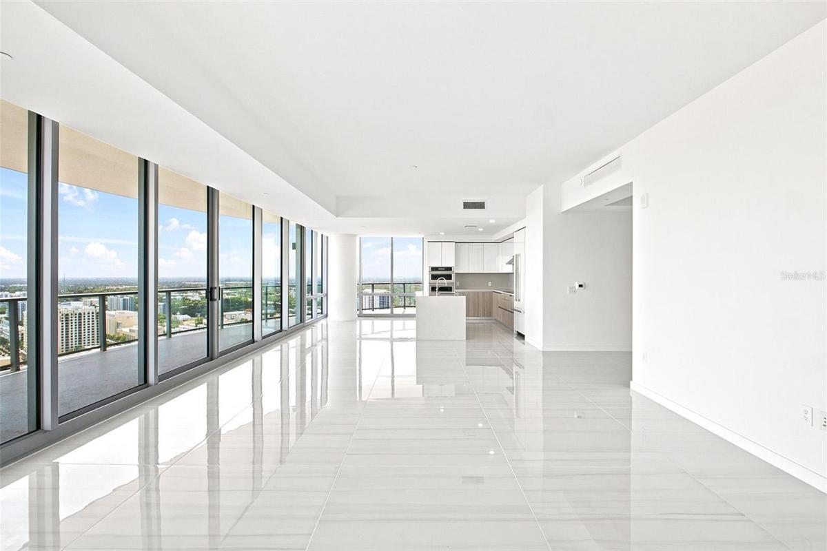 The wall of floor to ceiling windows maximize the view.