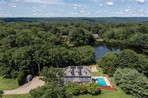 A rare opportunity to own a premier property with waterfront access to Ajello s Pond on Great Hill in Seymour nestled upon a private and perfectly placed serene setting.