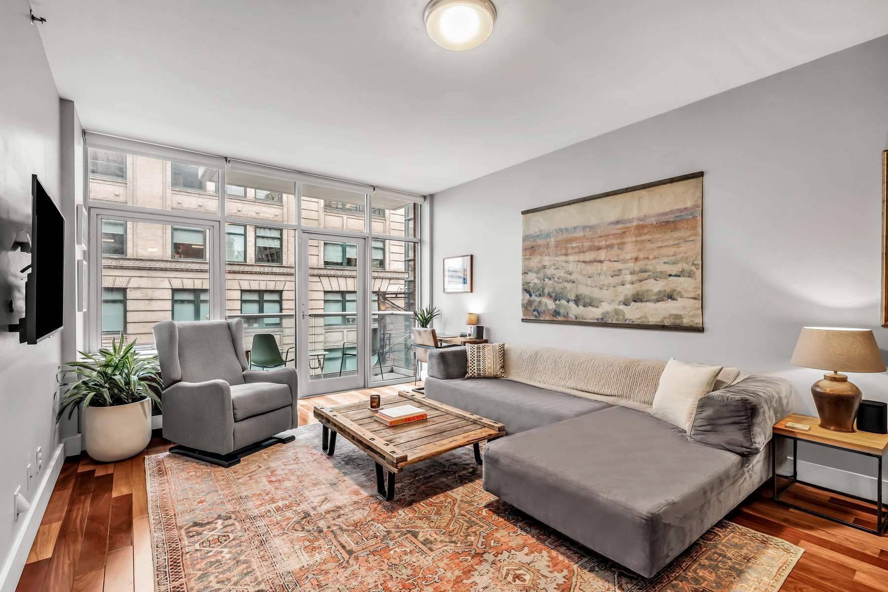 Modern, open and bright, 1 Bedroom with private Balcony off of the Living Room offering views of the water and overlooking picturesque Spring Street.