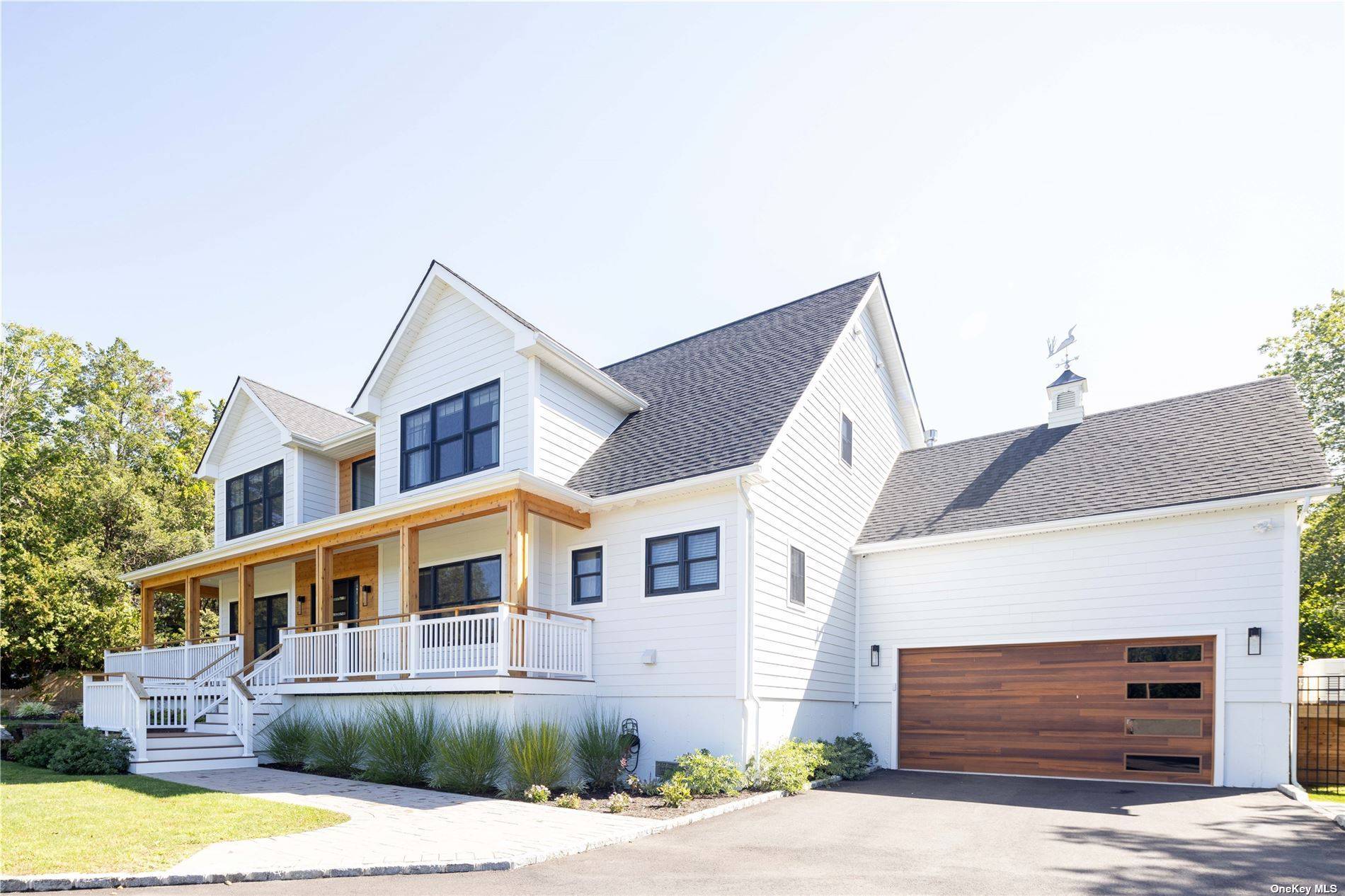 Enjoy this spacious and stunning new construction in East Quogue off season with its perfect location, south of the highway and close to the village.