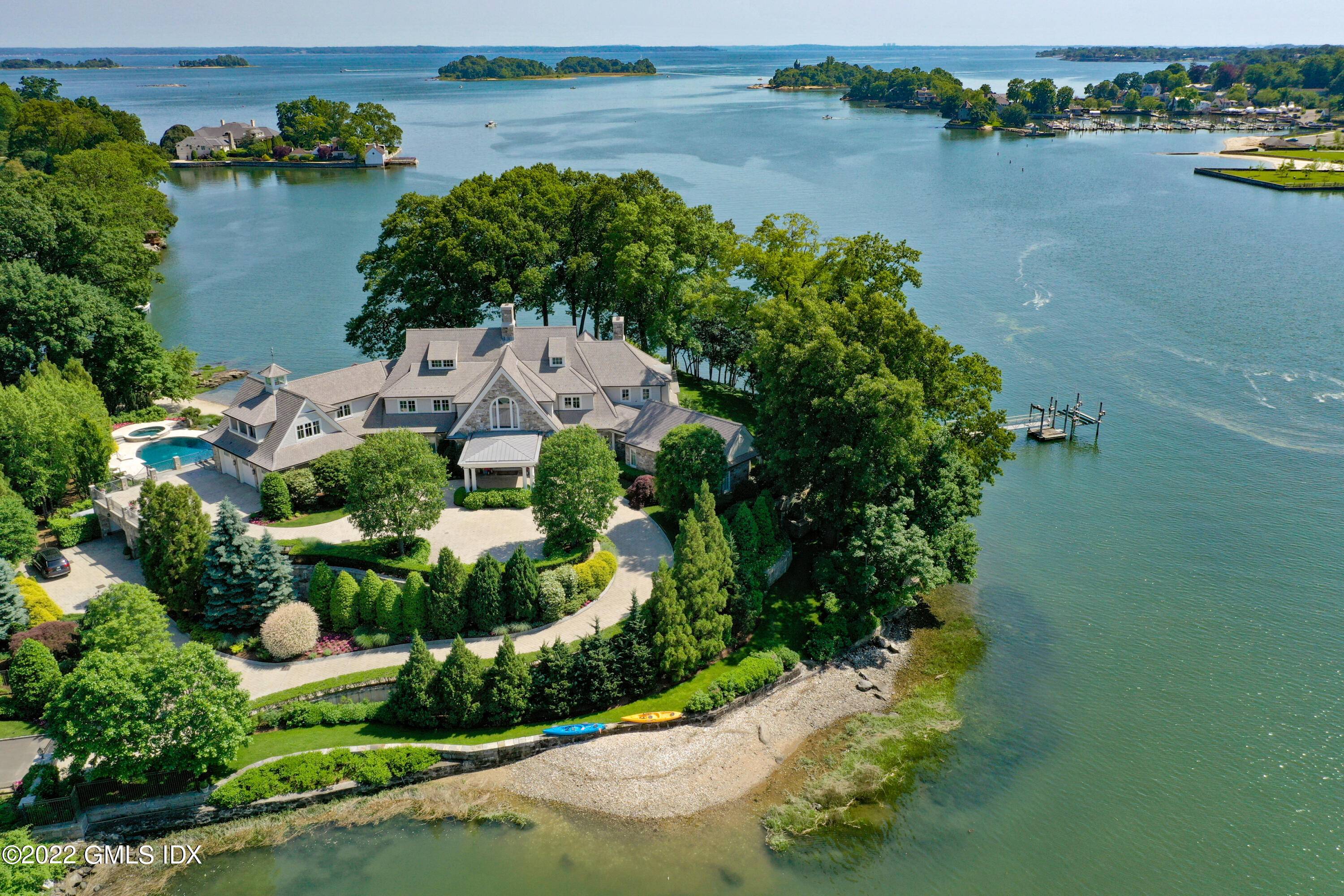 11 Island Lane is perfectly situated on a stunning peninsula w an impressive 280 degree water view 732' of private water frontage, 1.