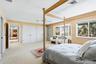Primary Suite on upper level offers 2 closets plus a walk-in closet and direct access out to the balcony overlooking the Gulf