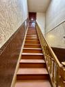 Stairway featuring wainscoting