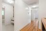 Hall featuring baseboards and light wood-style floors