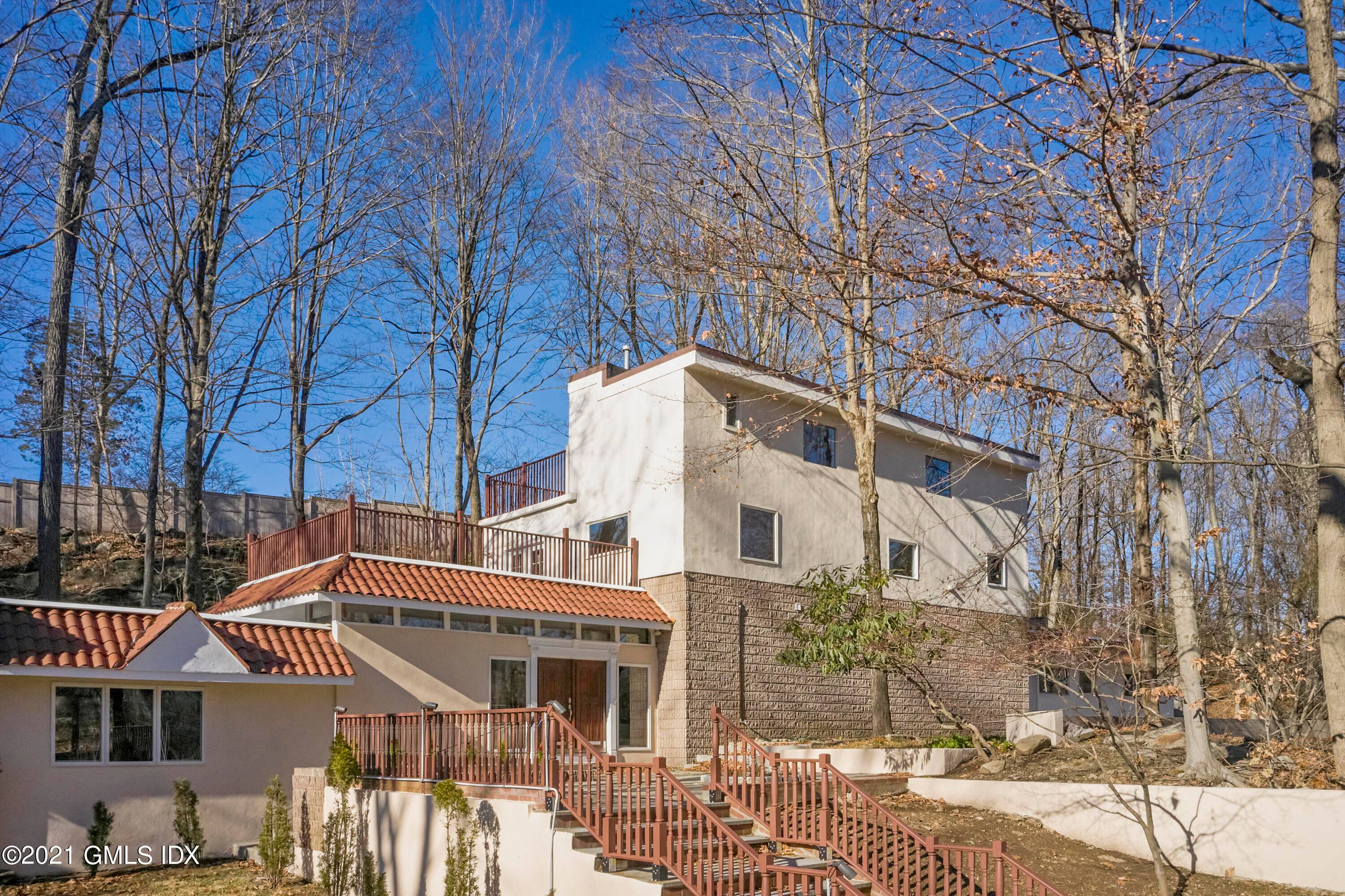 Unique, updated home, Bauhaus inspired design, by award winning architect, sits on a private 1.
