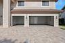 3-Car Garage features 2 heavy duty ceiling mounted storage racks and plenty of storage space on the sides