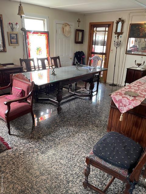Dining area featuring granite tiled floors