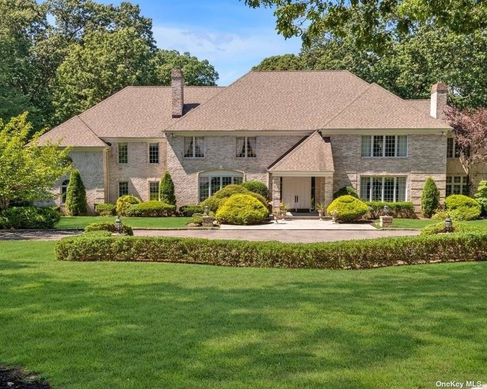 Discover a stunning Center Hall Brick Colonial, in the heart of Brookville, where classic elegance meets luxurious living.