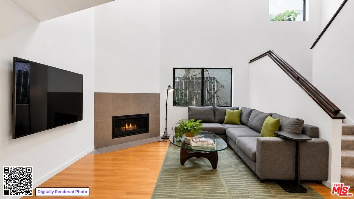 A contemporary fireplace adds