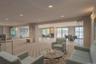 Communal seating area in the Paradise Harbor lobby with fireplace & Hudson River views.