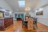 Formal Dinning room w/ bar and wood burning fire place