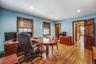 Office space with light wood-style flooring and recessed lighting