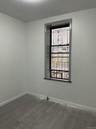Unfurnished room with baseboards and concrete flooring