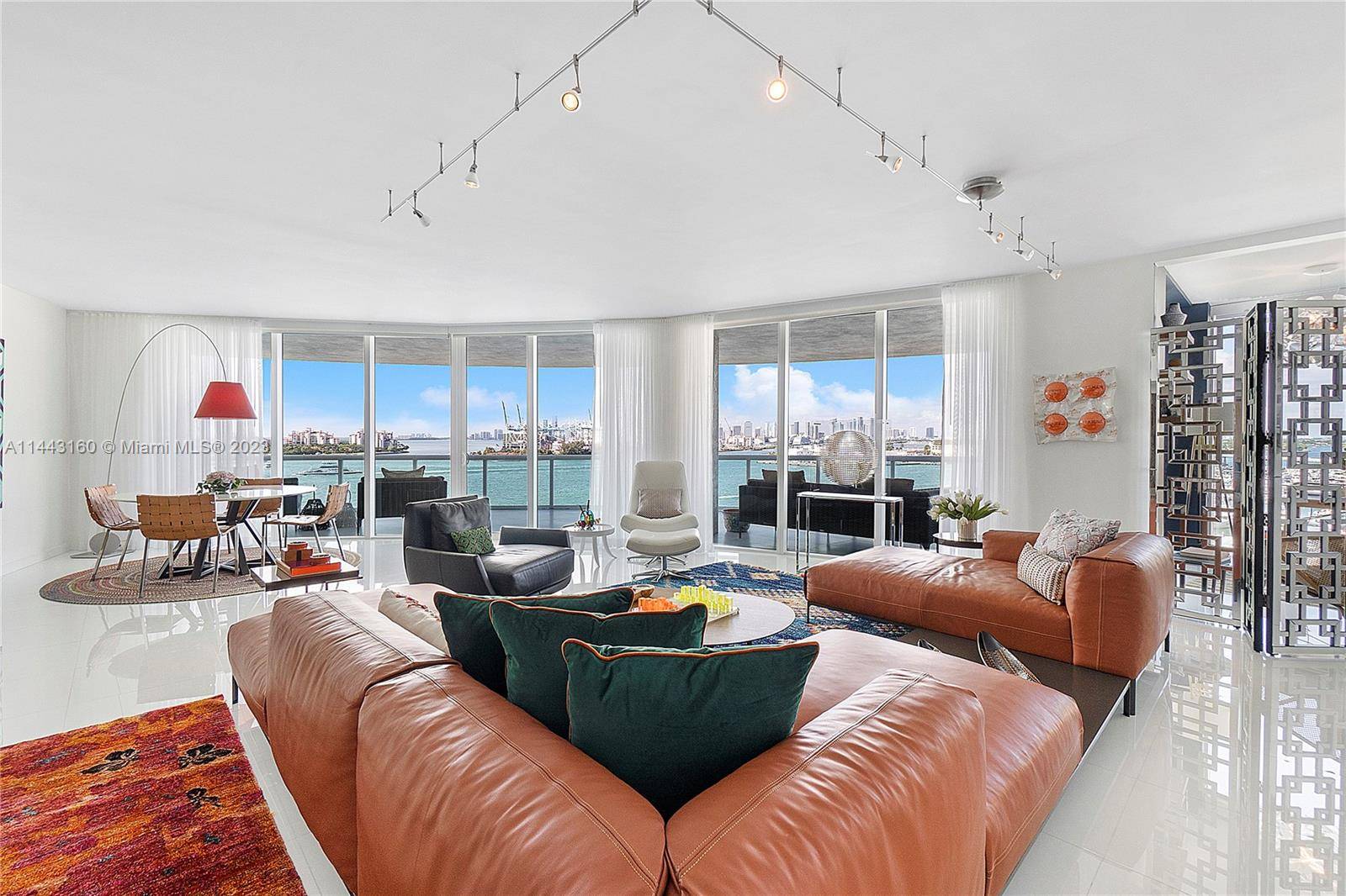 Experience one of a kind indulgence in this rare corner unit showcasing dramatic views of Biscayne Bay, Fisher Island, South Beach, and the glittering Miami cityscape.