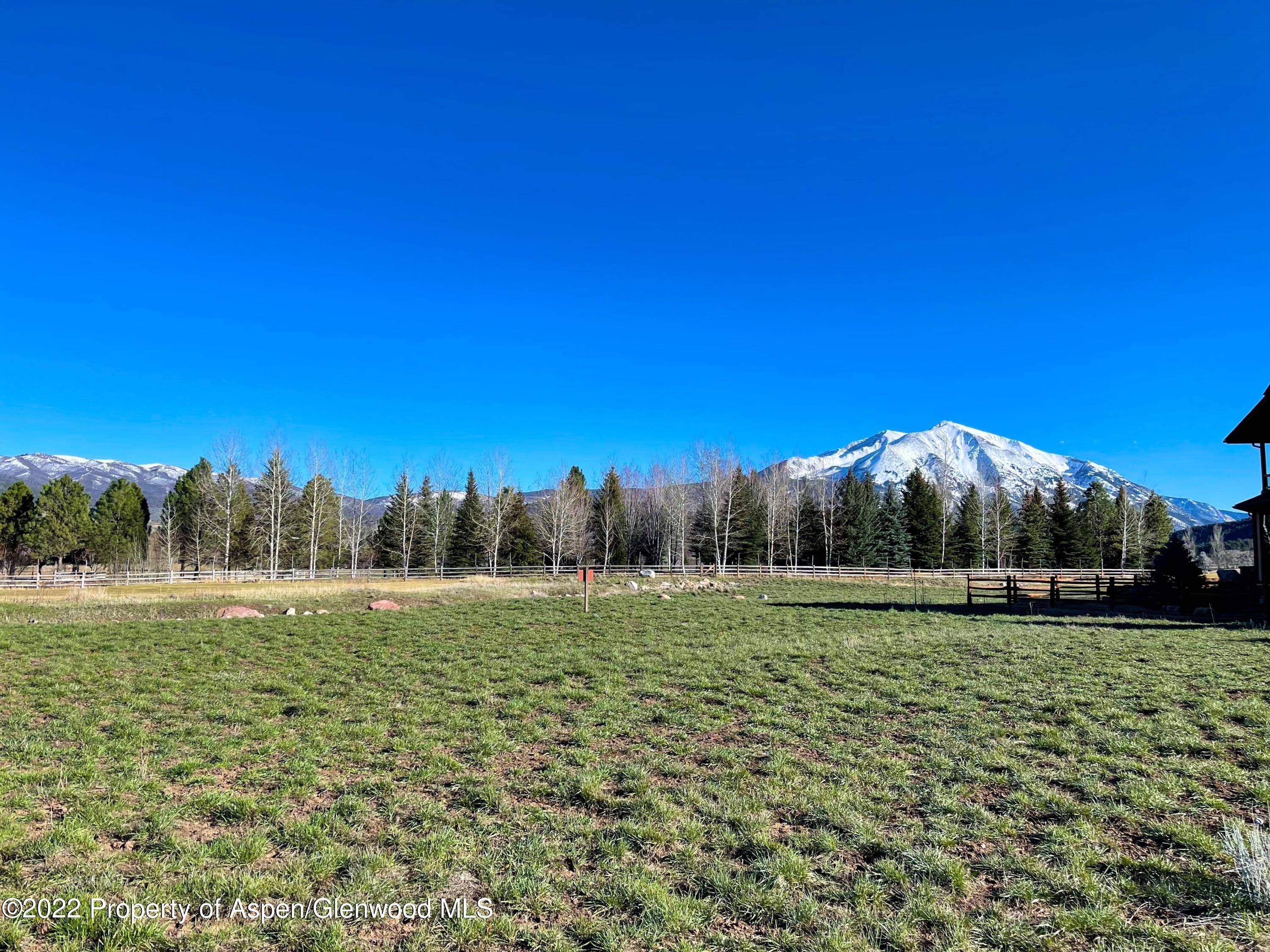 Majestic views of Mt. Sopris, Prince Creek and Thompson Ridge from this desirable flat homesite that overlooks the 14th fairway.