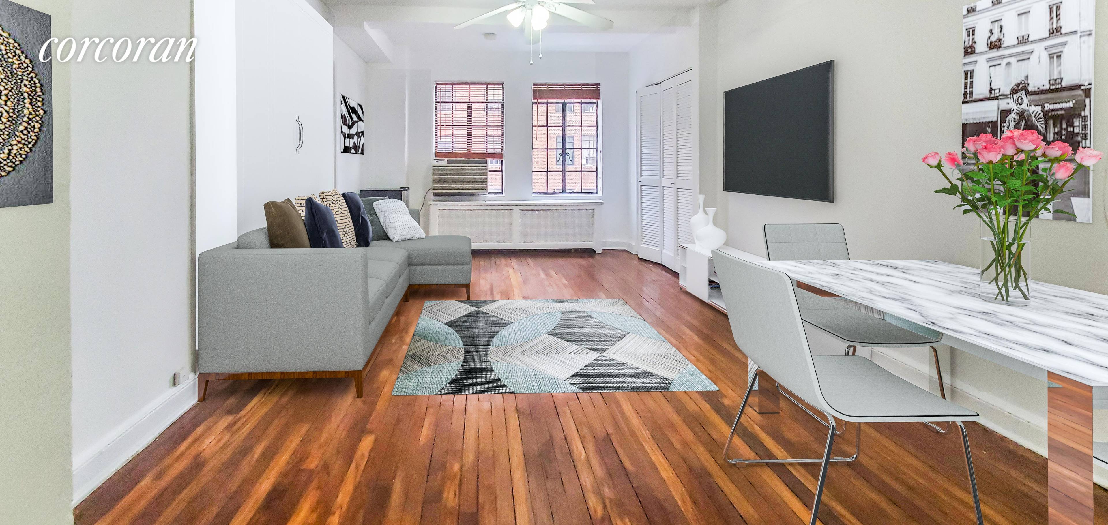 This charming prewar studio features high beamed ceilings, hardwood floors, good closet space, a kitchenette with dishwasher, and a pristine tile bathroom.