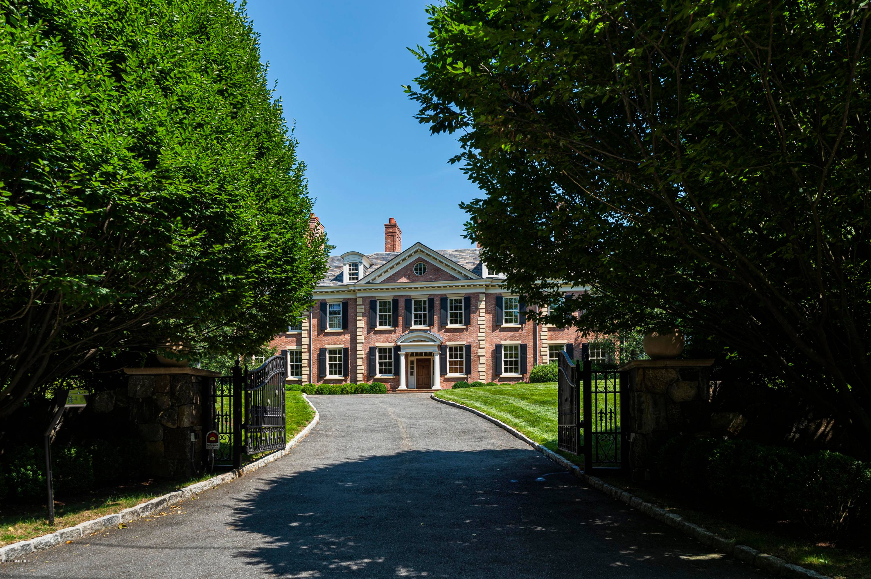 Sophisticated Mid Country, Georgian Colonial with gated driveway.