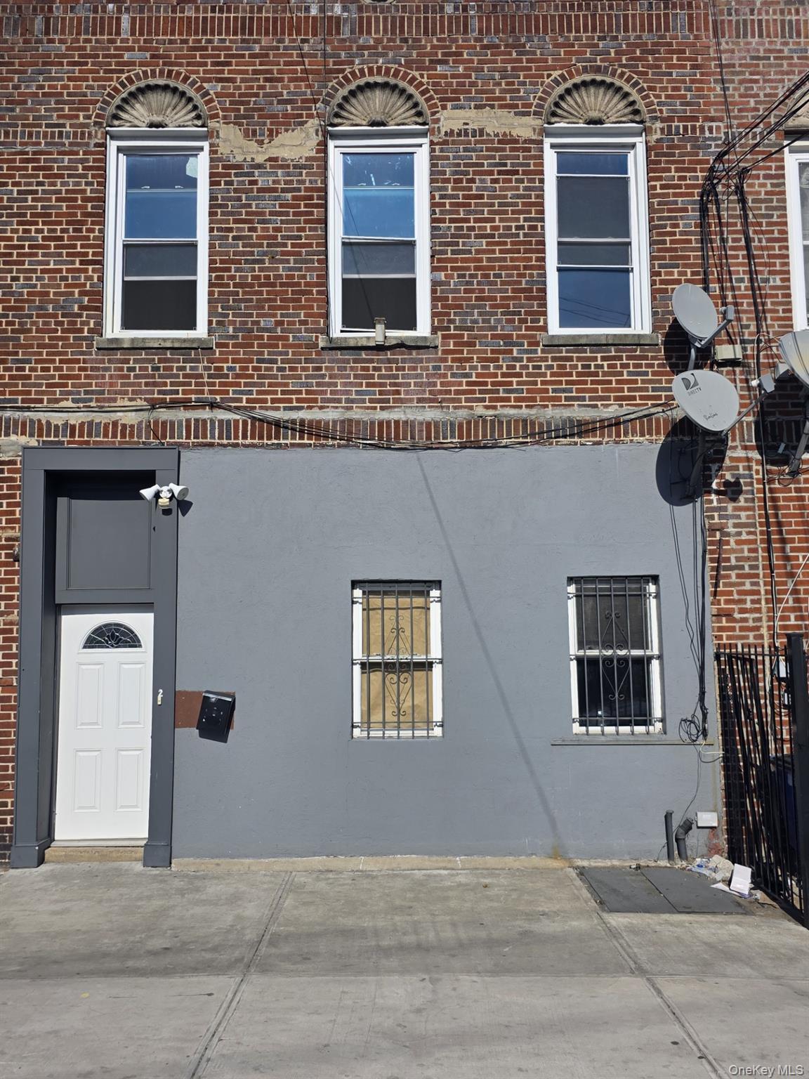 View of property exterior with brick siding