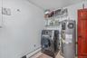Laundry area featuring washer / clothes dryer and water heater