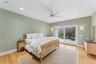 Bedroom featuring access to outside, light wood finished floors, a ceiling fan, and recessed lighting