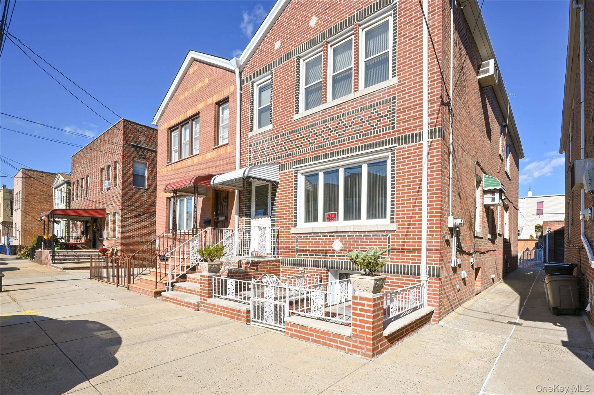 Solid brick semi detached 2 family home featuring 3 bedrooms over 3 bedrooms with a walk out basement.