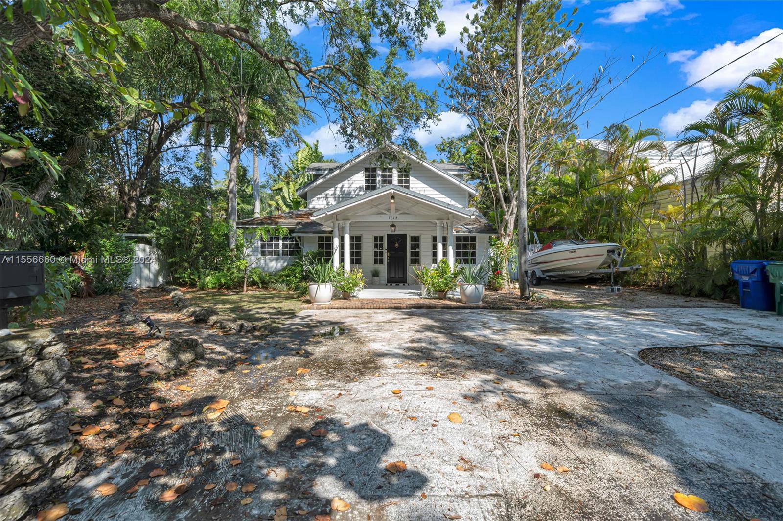 Welcome to this historic 1910 two story home in the serene and sought after neighborhood of North Coconut Grove.