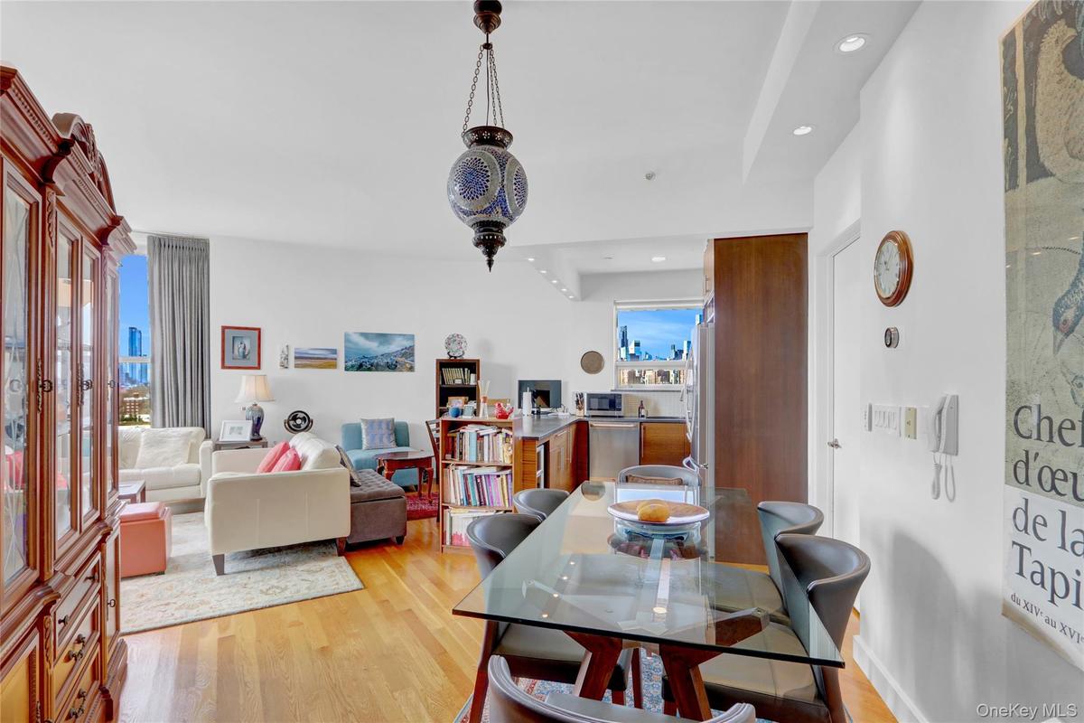Dining area with recessed lighting, light wood-style floors, and baseboards