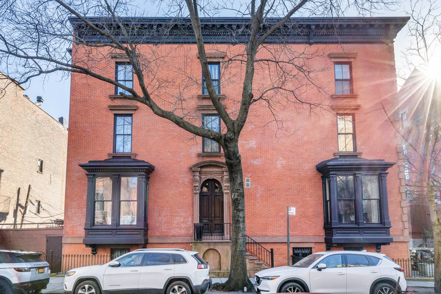 Perfectly positioned on a corner lot with bluestone walkway around, this beautiful Cobble Hill townhouse is filled with gorgeous original details throughout.