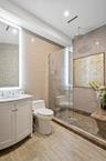 Full bath featuring vanity, a shower stall, recessed lighting, and tile patterned floors