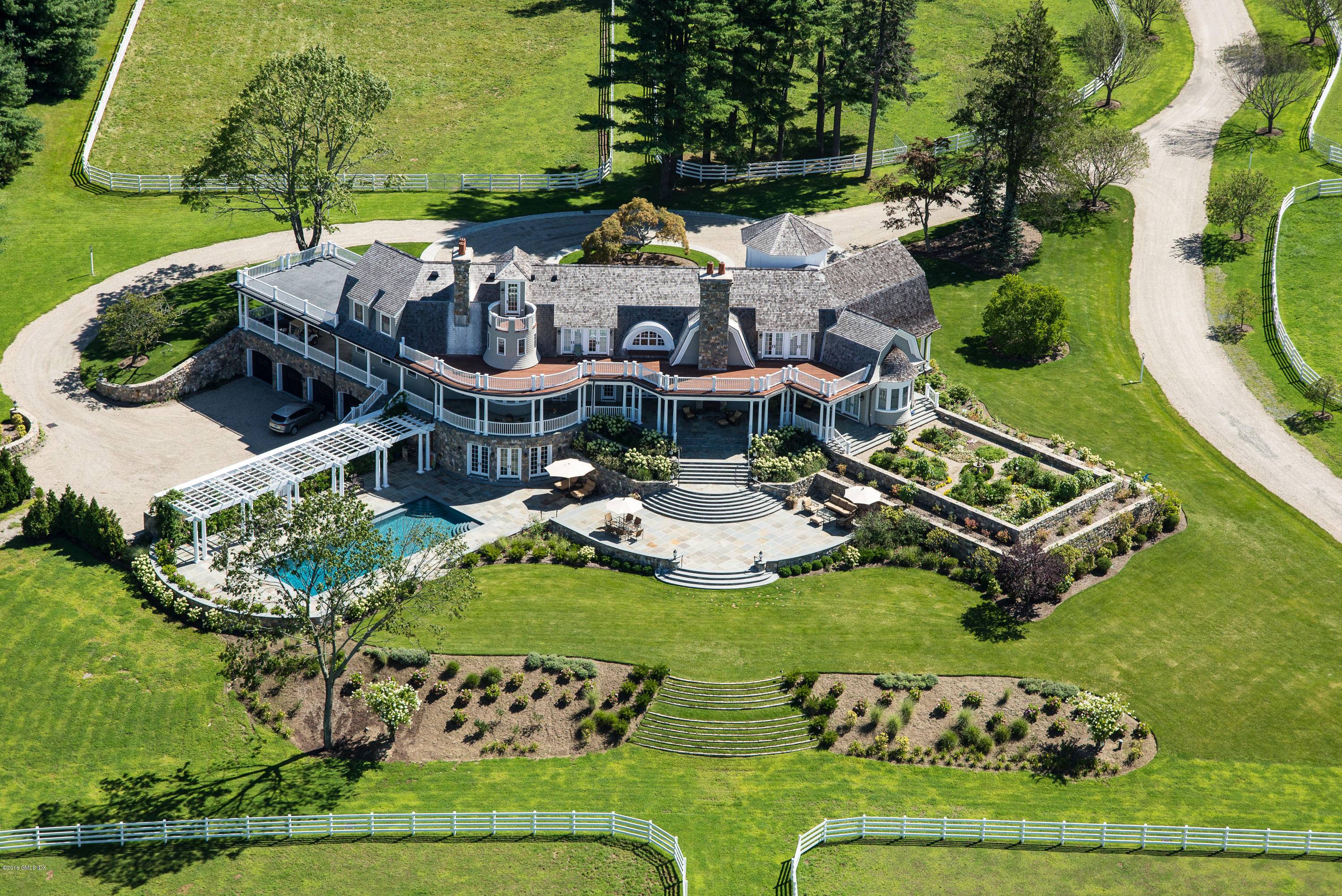 Turn key equestrian estate includes magnificent home w pool, Indoor and Outdoor riding rings, state of the art stable and housing for grooms trainer.