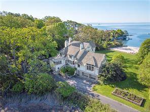 Spectacular waterfront home with its own expansive, private sandy beach on Butler s Island in Tokeneke Association, a private residential park on the Fairfield County Gold Coast, less than an ...