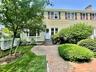 Private backyard with brick patio. Landscaping and snow removal included.