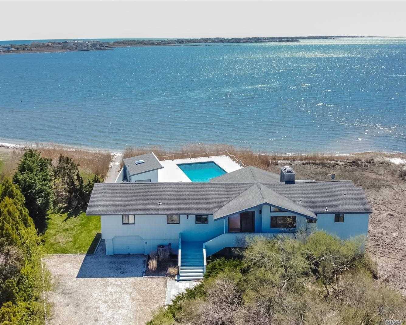Quelle Spot ! This Westhampton Beach Village home sits directly on Moriches Bay with panoramic water views all the way to Dune Road.