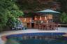 Pool featuring exterior kitchen, a patio, and grilling area