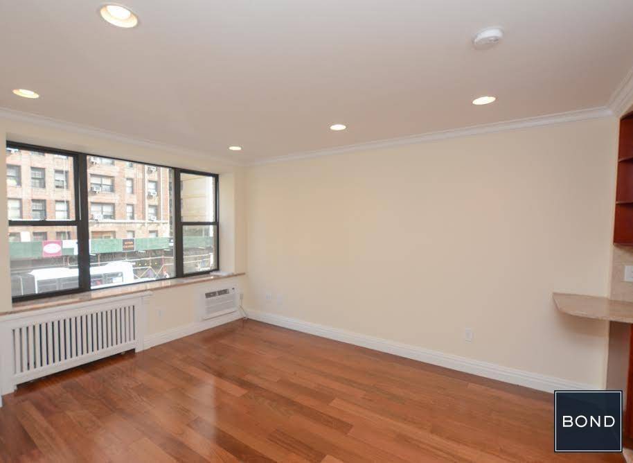 Beautifully renovated studio apartment in convenient Midtown East location next to the NQR and 123 Trains.
