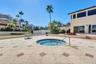 Grand Bay Swimming Pool heated spa area and Barbecue. New Patio Furniture, Lounge Chairs, Sofa's, Umbrellas and Barbecue Area