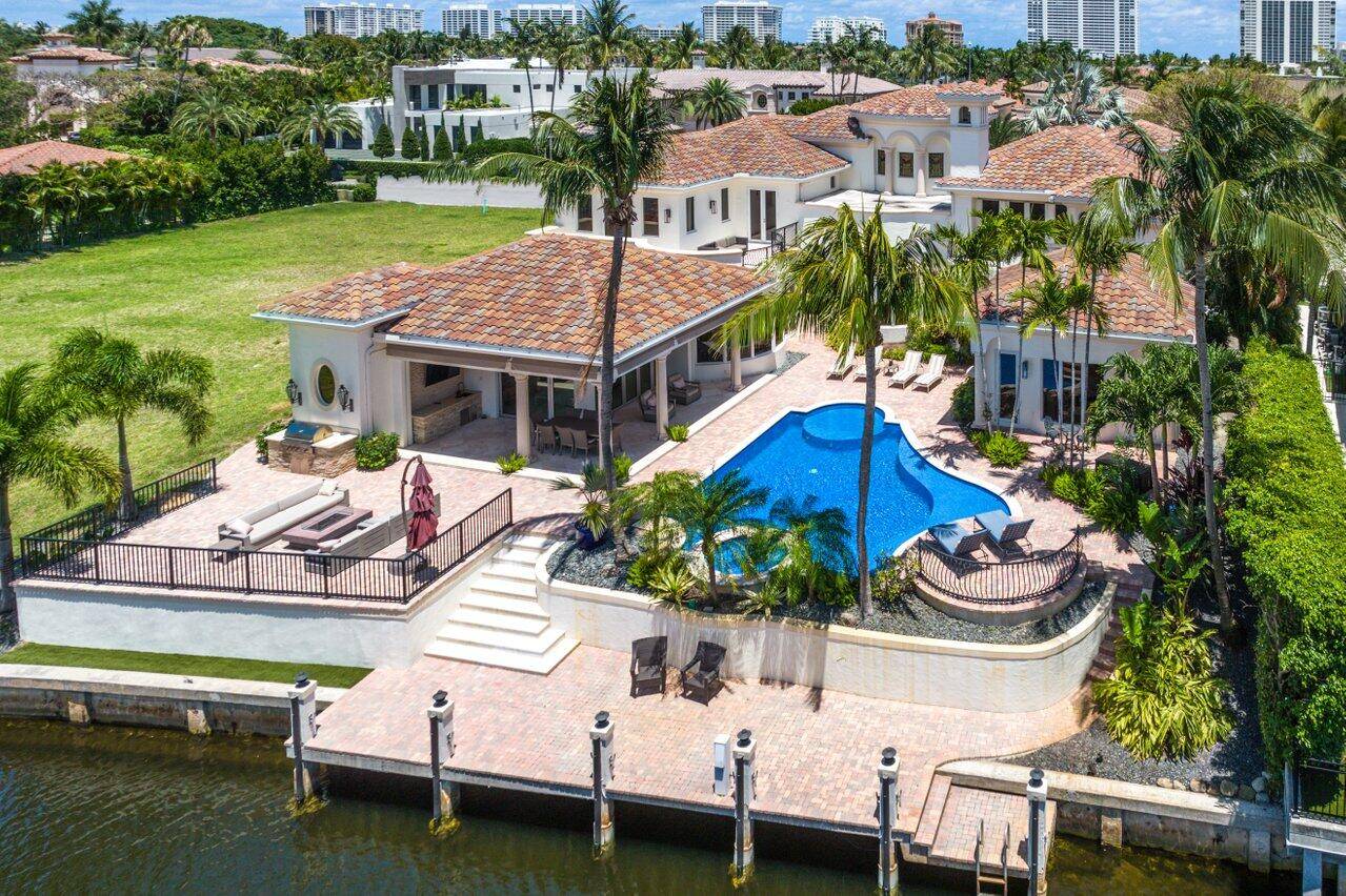 Gorgeous waterfront estate home located on the east end of Coconut Palm Road in Royal Palm Yacht Country Club, This residence has been recently updated with stunning transitional interior and ...