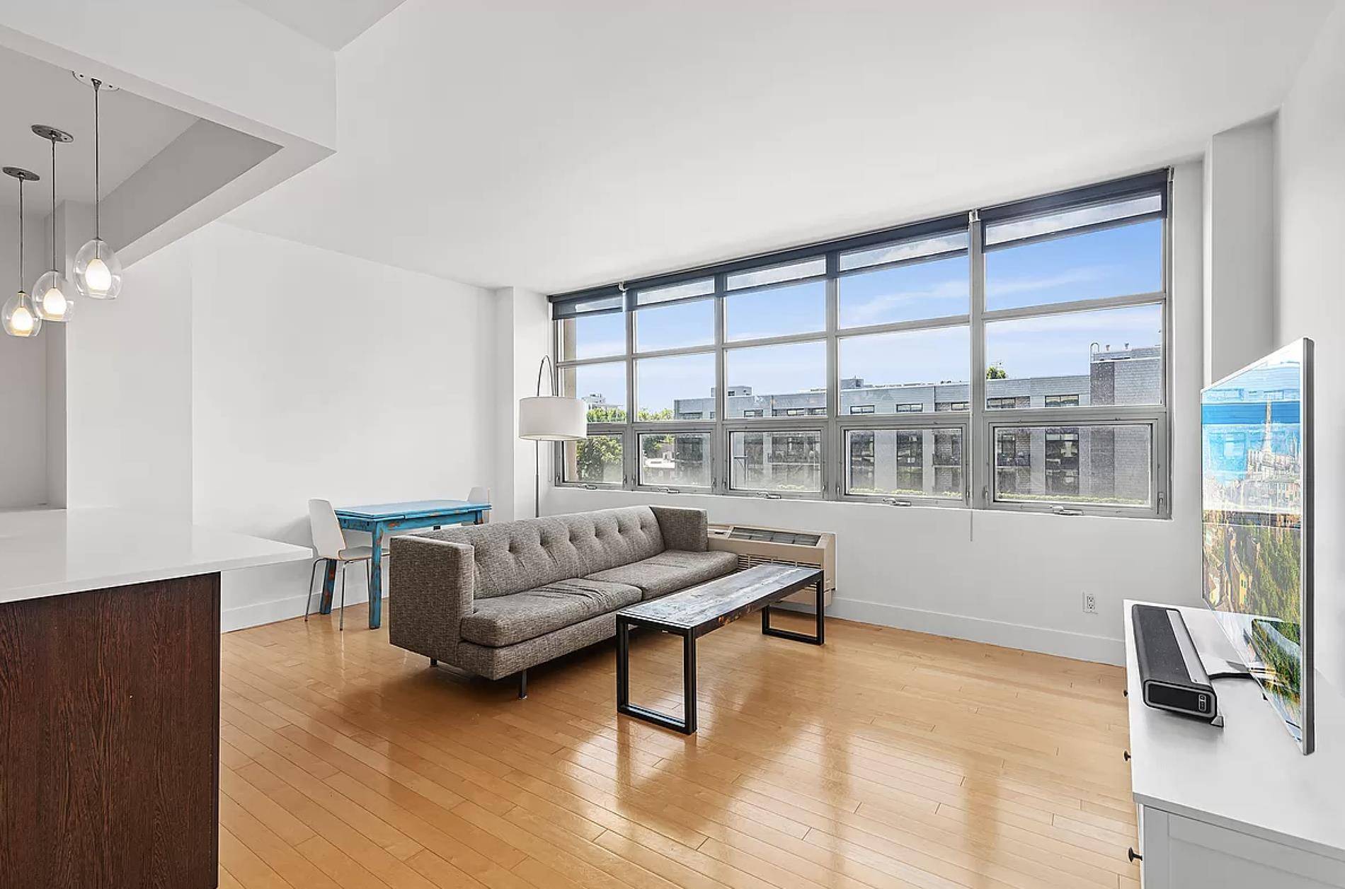 Beautiful 700 Sq Ft one bedroom with southern views of the Manhattan skyline, natural sunlight from a wall of oversized windows, maple hardwood flooring with a more than generous sized ...
