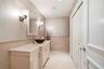 Guest half bathroom and washer-dryer on the main level.