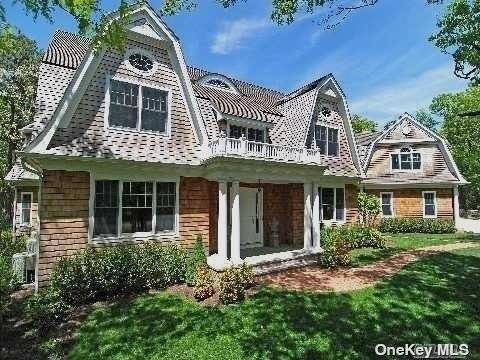 Beautiful 6 bedroom Gambrel style home on a flat 1.
