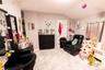 Living room with lofted ceiling and light marble finish flooring